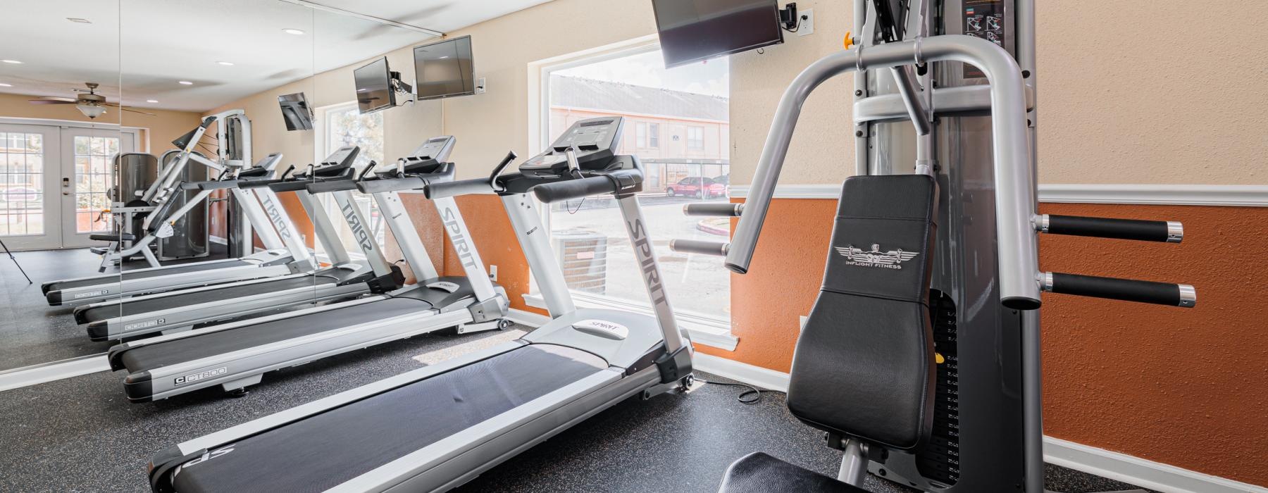 a gym with treadmills